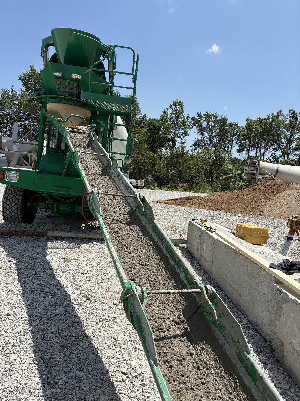 Mixer truck pouring concrete on a jobsite