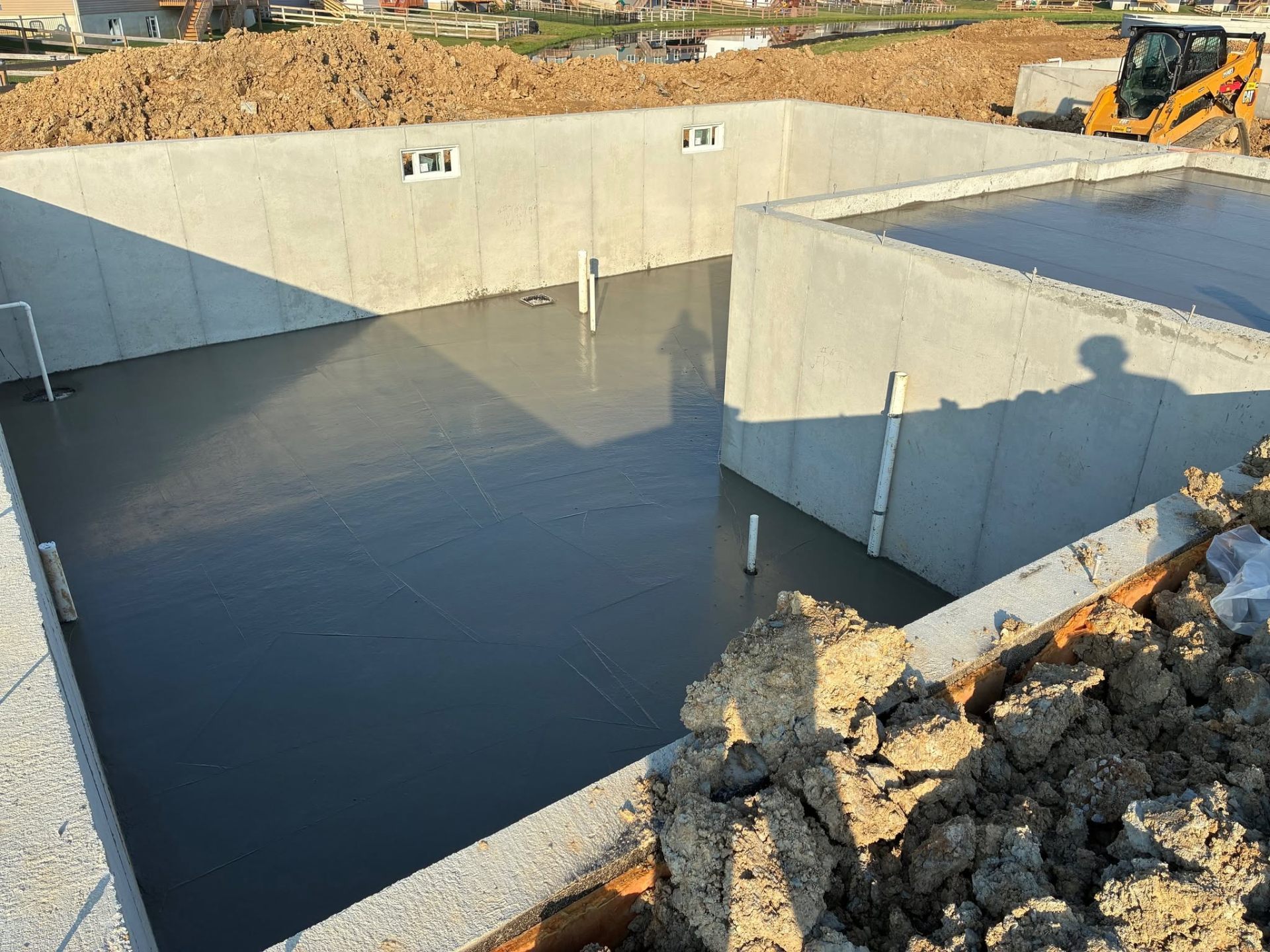 Kelley concrete being poured into a footing form on site